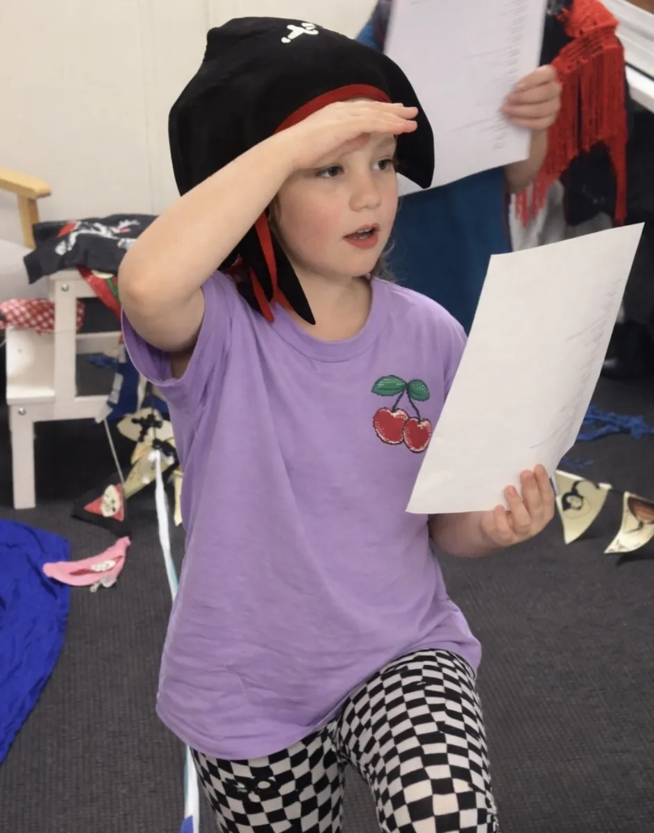 Student in costume exploring character during a speech and drama class