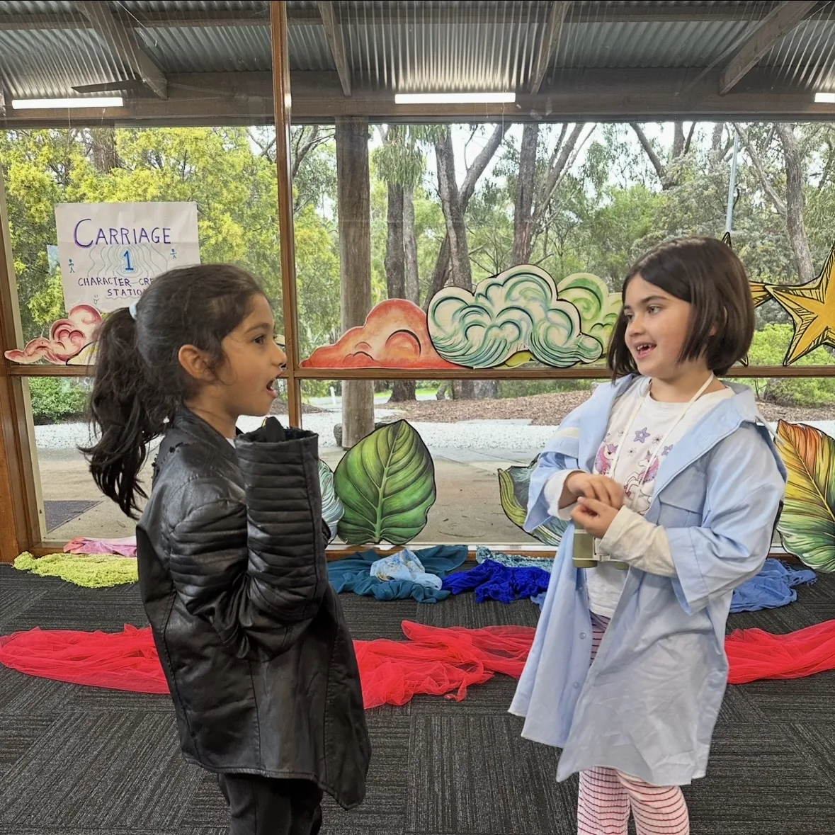 Two speech and drama students improvising a scene together in costume