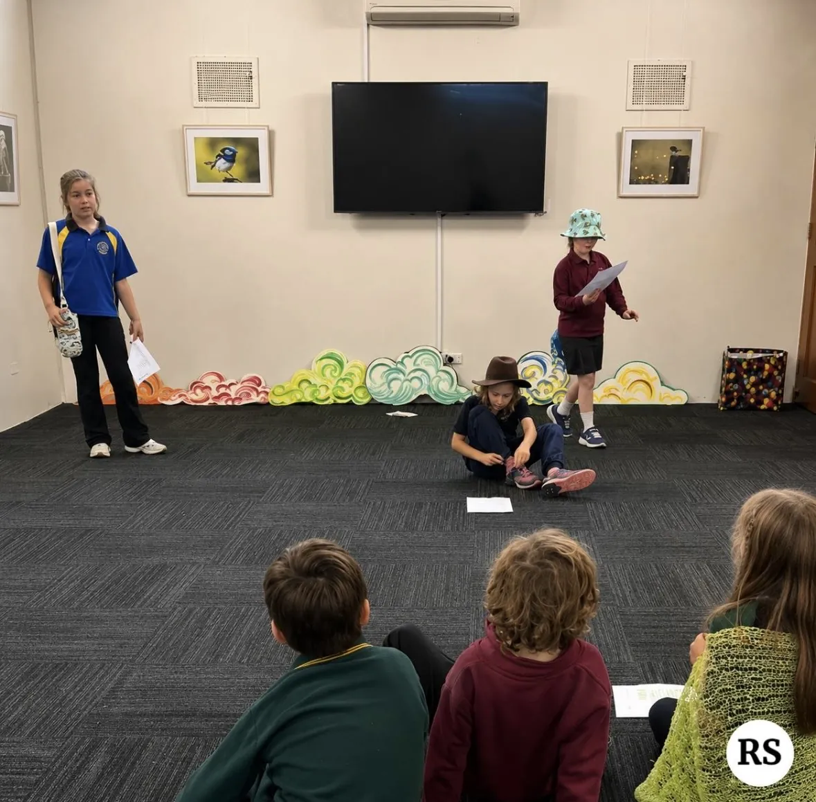 Students taking part in a drama movement game in the hall at Ranges Studio