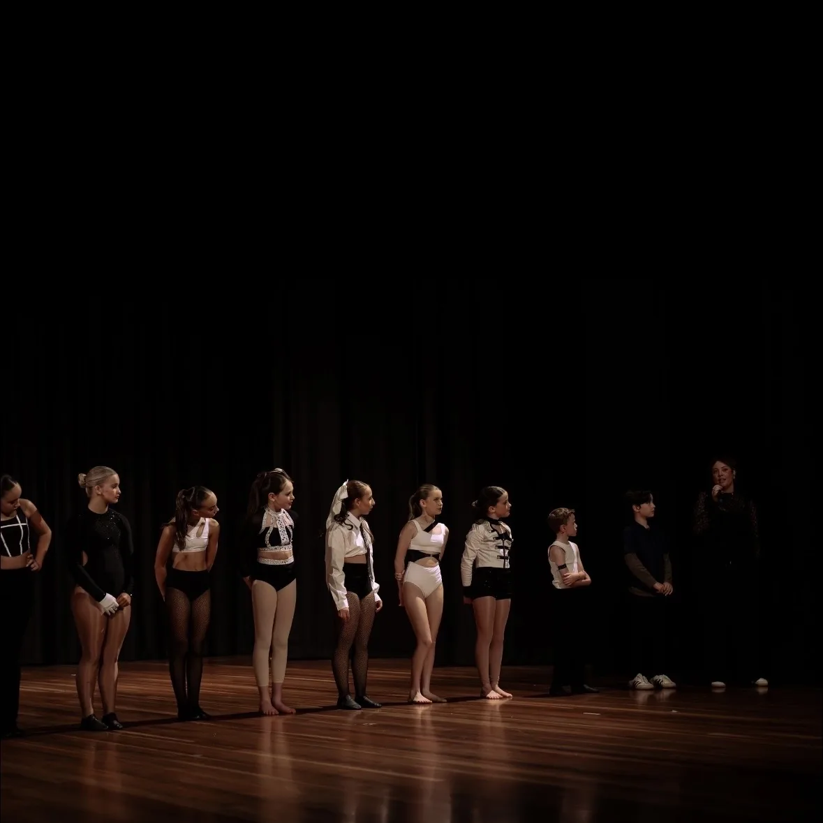 Ensemble of speech and drama students lined up on stage at a Ranges Studio showcase