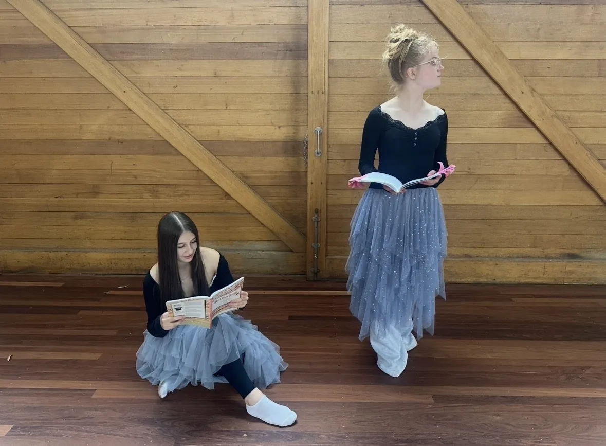 Students performing a movement piece on stage at Ranges Studio