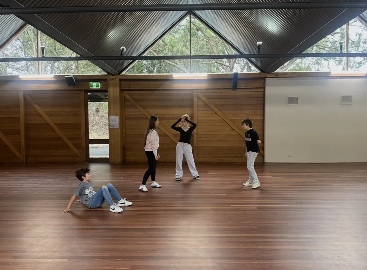 Students performing together in the hall during a speech and drama class