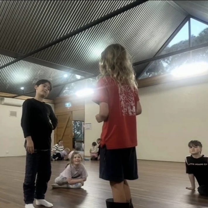 A speech and drama student working through a scene while her classmates watch