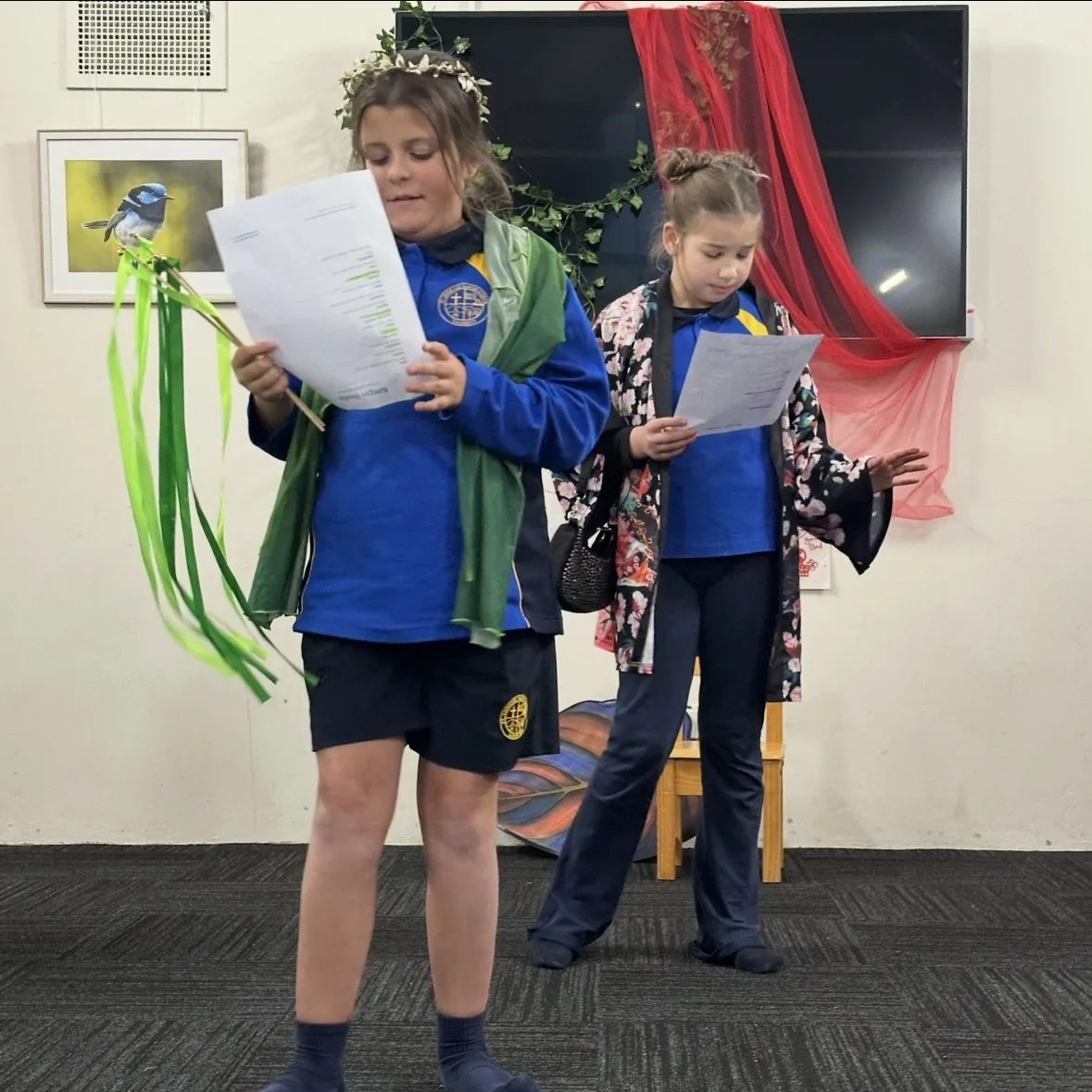 Two speech and drama students reading from scripts during a class at Ranges Studio