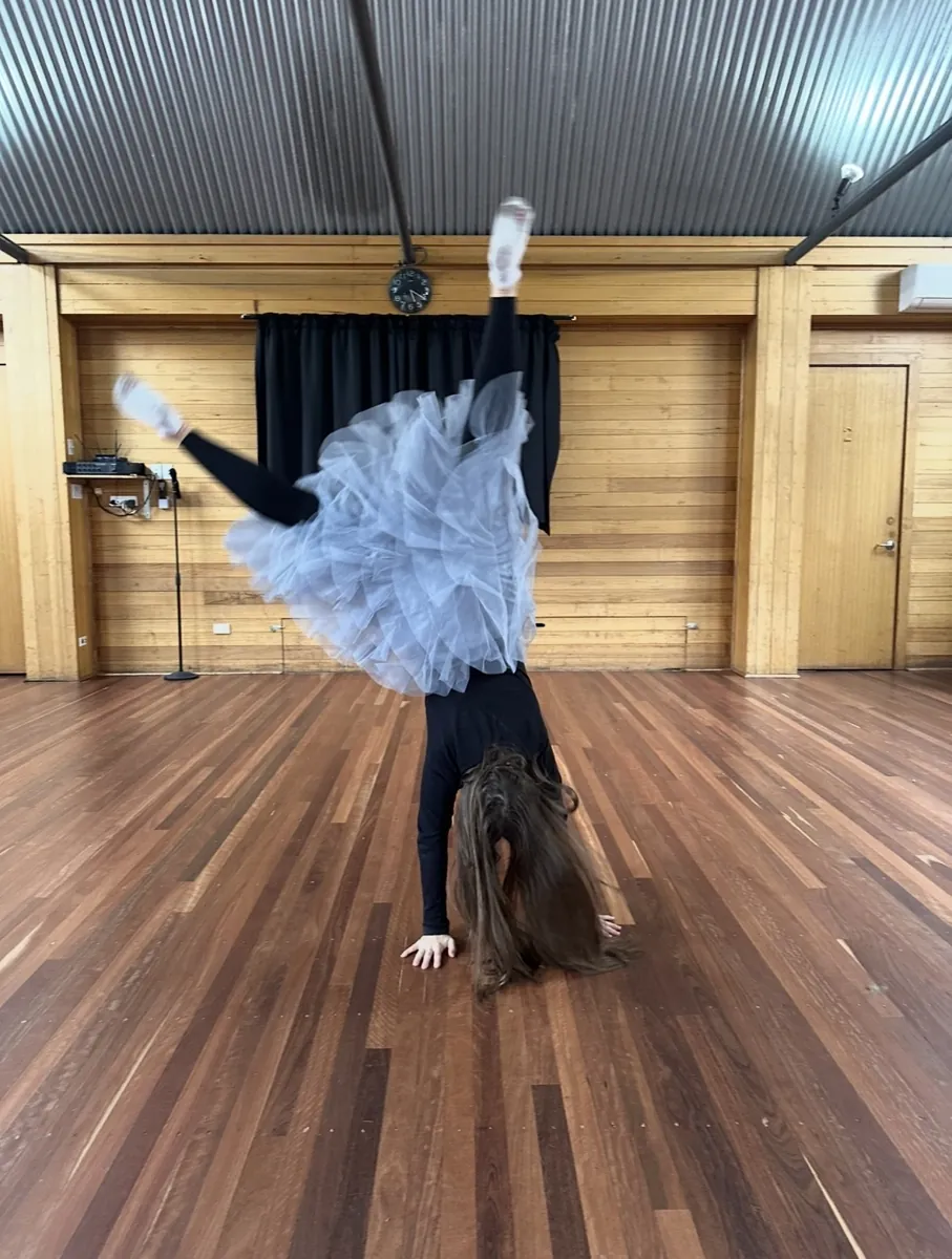 Student performing a solo on stage during a Ranges Studio production
