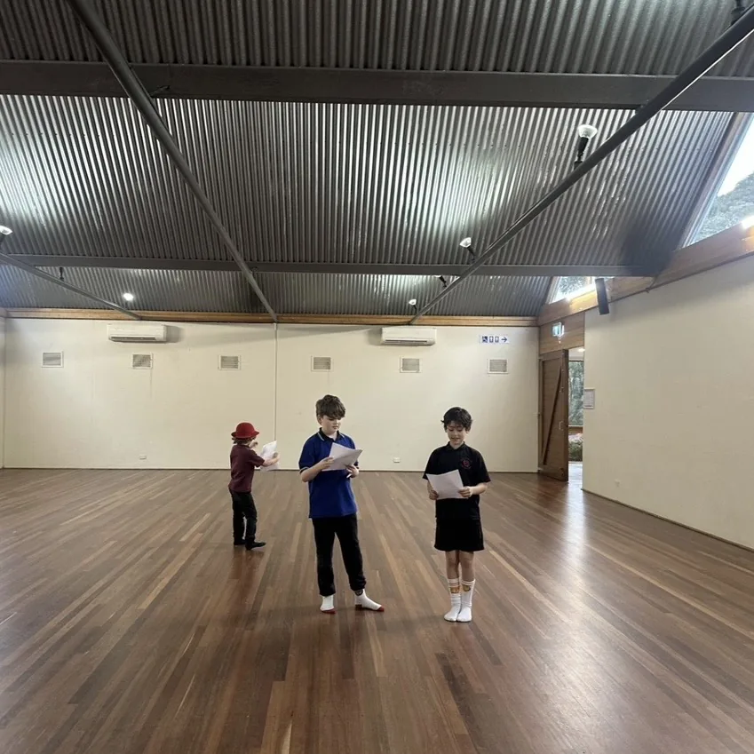 Three speech and drama students rehearsing together in the hall