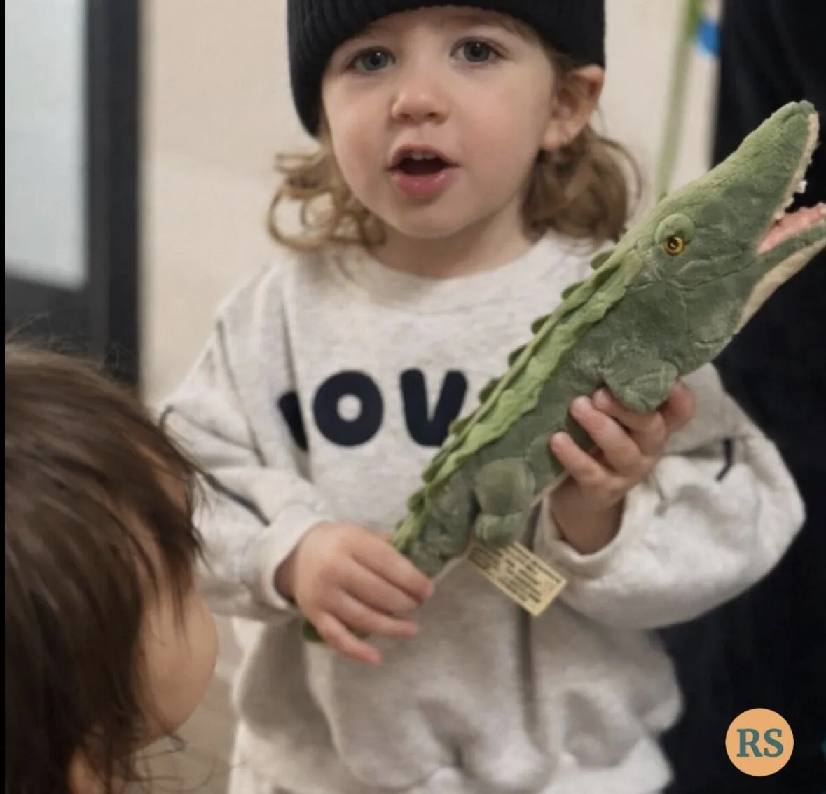 Young children taking part in a hands-on group activity at a Tell & Show class