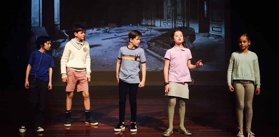 Students performing on stage